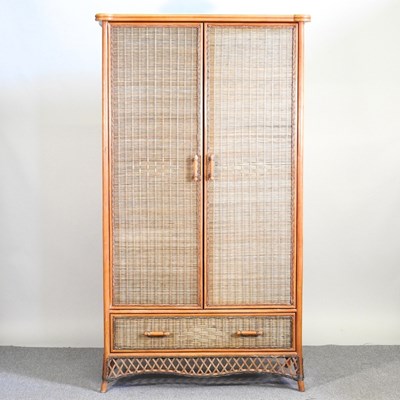 Lot 476 - A modern rattan wardrobe