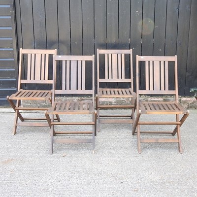 Lot 299 - A set of four folding wooden garden chairs (4)