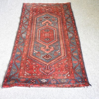 Lot 72 - A Turkish woollen rug, with a central...