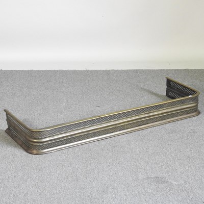 Lot 557 - A 19th century pierced brass fender, 118cm wide