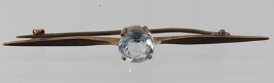 Lot 65 - A 9 carat gold sapphire and diamond set horseshoe bar brooch