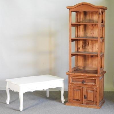 Lot 256 - A Mexican pine open bookcase, with cupboards...