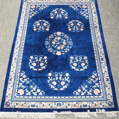 Lot 757 - A large oriental rug