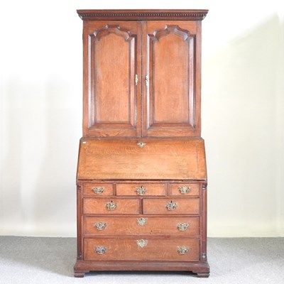 Lot 281 - An 18th century oak and inlaid bureau cabinet,...