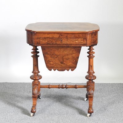 Lot 109 - A Victorian walnut ladies work table, with a...