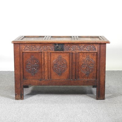 Lot 161 - An 18th century carved oak coffer, with a...