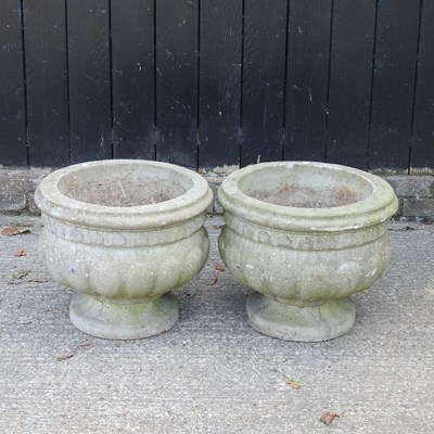 Lot 92 - A pair of cast stone garden urns, 51cm wide (2)