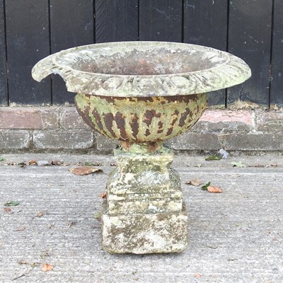Lot 459 - A painted cast iron garden urn, 61cm wide