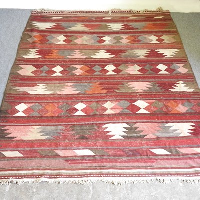 Lot 559 - A Persian kelim rug, with geometric motifs, on...