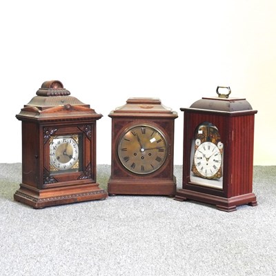 Lot 518 - A late 19th century walnut cased mantel clock,...