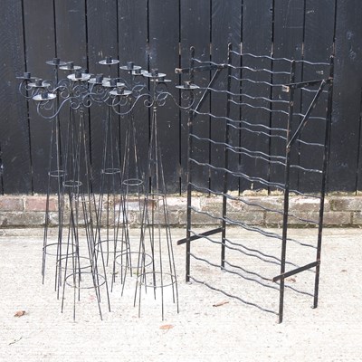 Lot 265 - An iron wine rack, together with six metal...