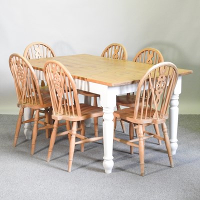 Lot 182 - A modern pine dining table on painted legs,...