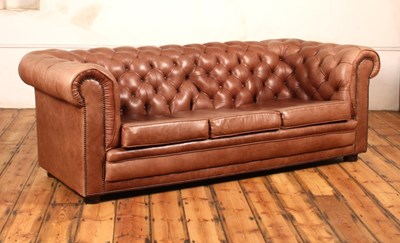 Lot 37 - A tan leather buttoned upholstered...