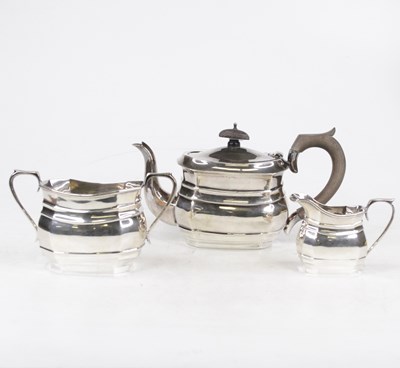 Lot 61 - A George V silver harlequin three-piece tea...