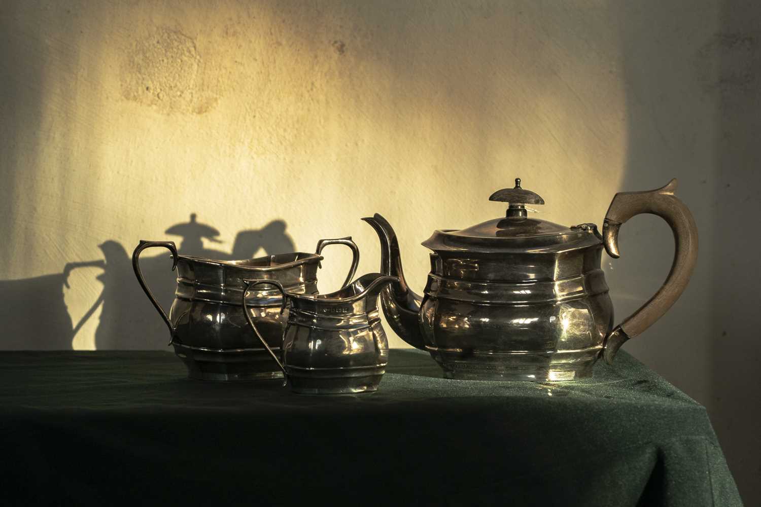 Lot 61 - A George V silver harlequin three-piece tea...