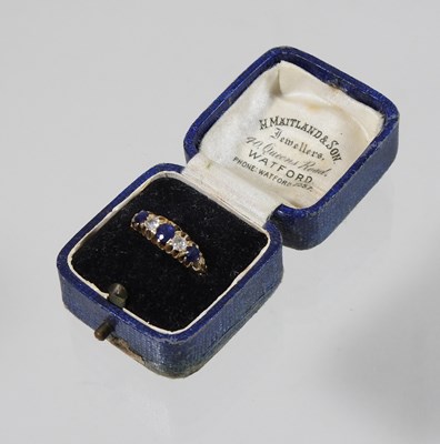 Lot 41 - An 18 carat gold five stone sapphire and diamond ring