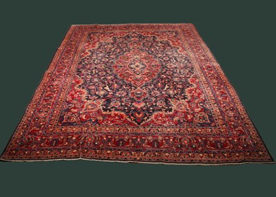 Lot 14 - A large Persian Tabriz woollen rug, the...