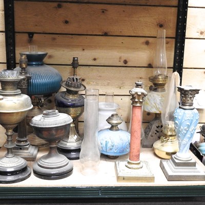 Lot 216 - A collection of mainly 19th century oil lamps...