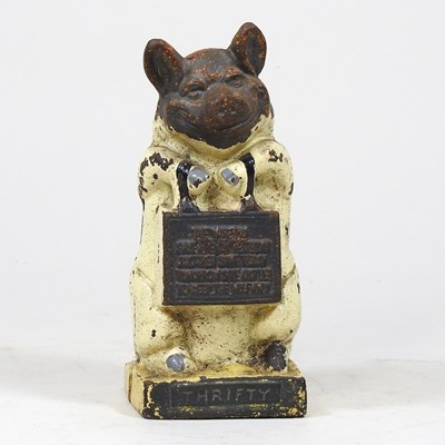 Lot 424 - A cast iron pig money bank, Thrifty, 17cm high