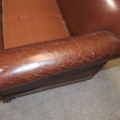 Lot 79 - A 1920's brown upholstered sofa