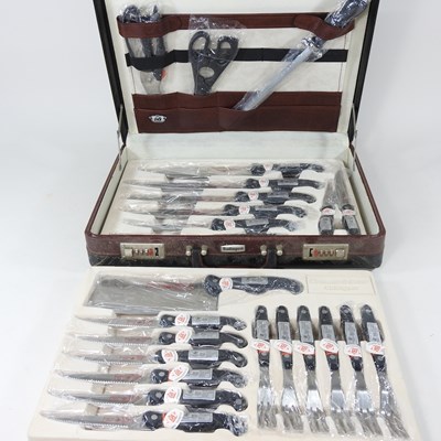 Lot 262 - A Solingen chef's knife set, cased, 45cm wide