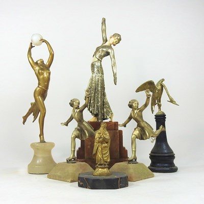 Lot 245 - An Art Deco style gilt and resin figure of a...