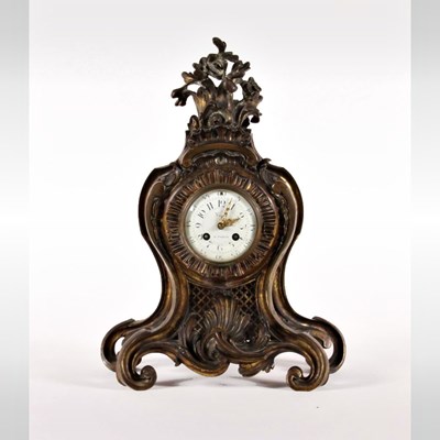 Lot 228 - A Rococo style gilt bronze mantel clock, 19th...