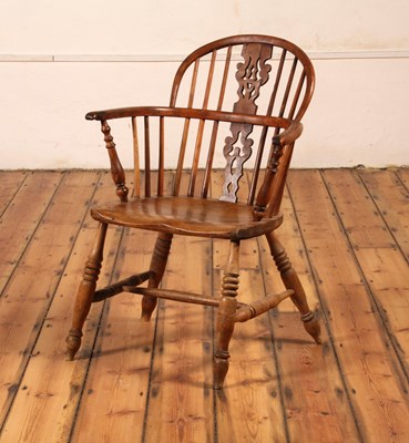 Lot 312 - An elm, yew and fruitwood Windsor armchair,...