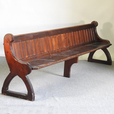 Lot 316 - A 19th century stained pine church pew, with a...