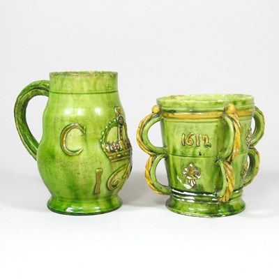 Lot 410 - A Castle Hedingham pottery green glazed mug,...