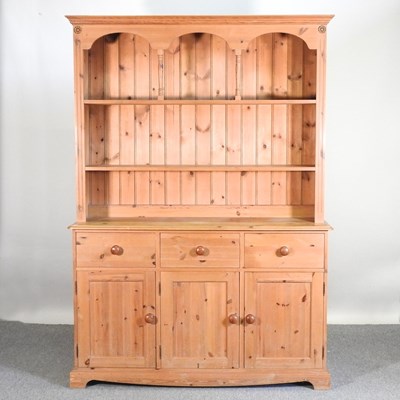 Lot 350 - A modern pine kitchen dresser, having an...