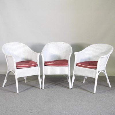 Lot 607 - Three white painted Lloyd Loom armchairs with...