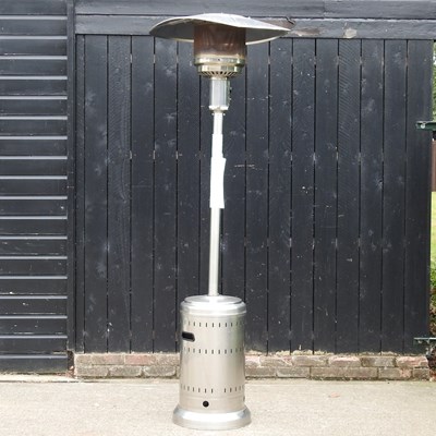 Lot 457 - A stainless patio heater, 240cm high, with cover