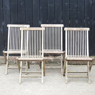 Lot 426 - A set of four teak folding garden chairs (4)