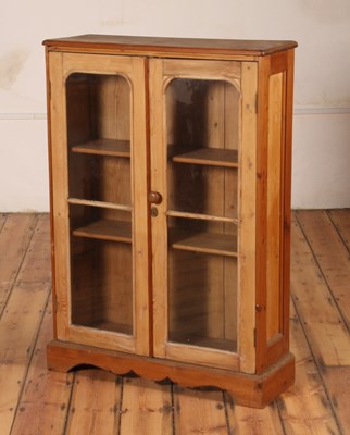 Lot 243 - A pine bookcase, 19th century, having a pair...