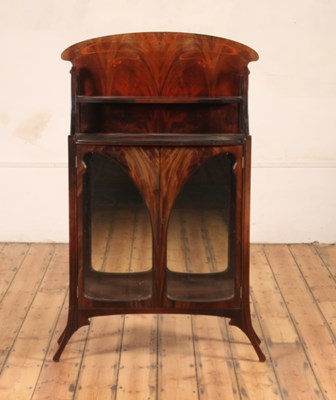 Lot 326 - An Art Nouveau flame mahogany double door...