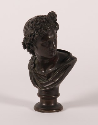 Lot 8 - A bronze head and shoulders bust of Apollo...