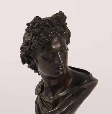 Lot 8 - A bronze head and shoulders bust of Apollo...