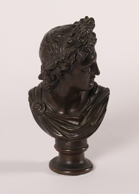 Lot 8 - A bronze head and shoulders bust of Apollo...