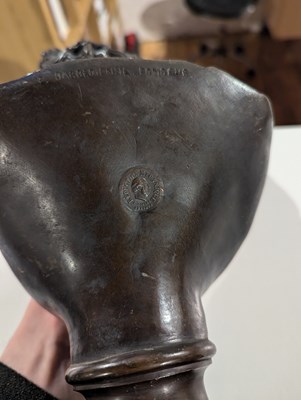 Lot 8 - A bronze head and shoulders bust of Apollo...