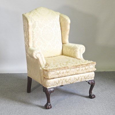 Lot 88 - A Queen Anne style yellow upholstered armchair,...