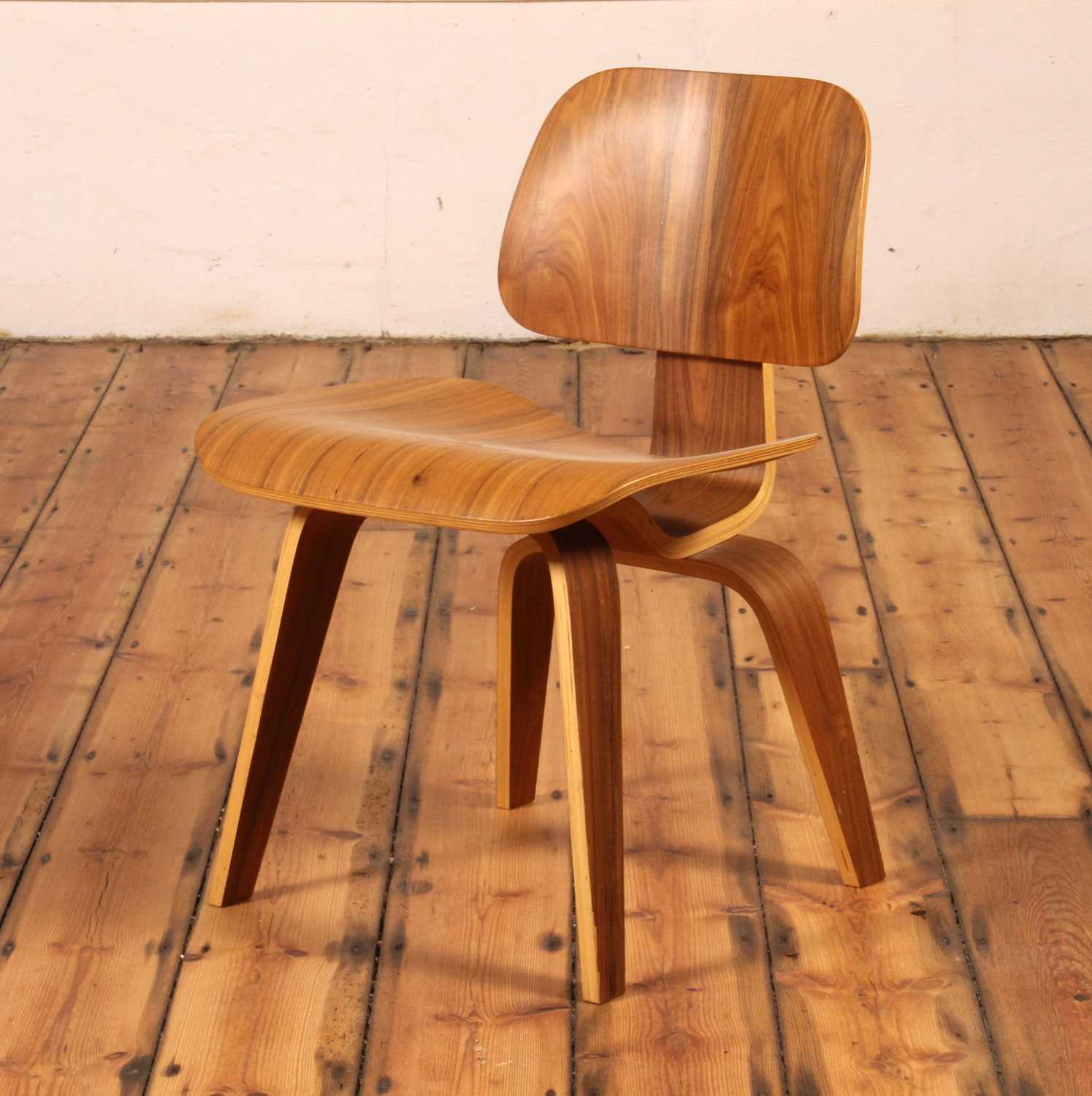 Lot 17 - An LCW walnut and plywood chair, after a...