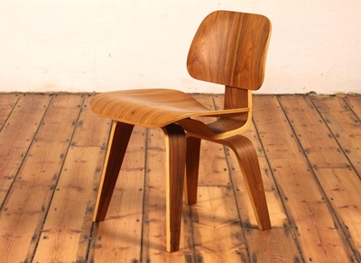 Lot 17 - An LCW walnut and plywood chair, after a...