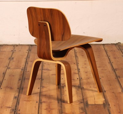 Lot 17 - An LCW walnut and plywood chair, after a...