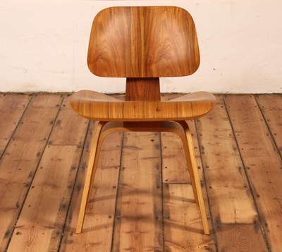 Lot 17 - An LCW walnut and plywood chair, after a...