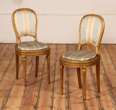 Lot 309 - A pair of French gilt wood salon side chairs,...