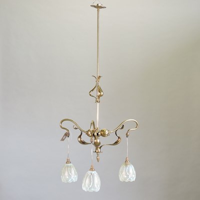 Lot 247 - An Arts and Crafts brass three branch ceiling light