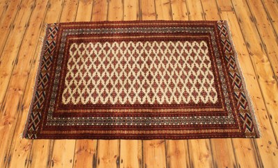 Lot 537 - A Persian Bokhara woollen rug, having a field...