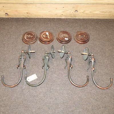 Lot 224 - A set of four Arts and Crafts brass gas wall lights