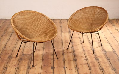 Lot 207 - A pair of wicker satellite chairs, 1960s, each...